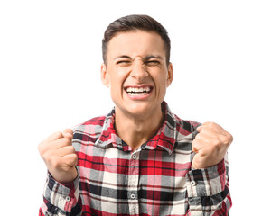 Portrait of angry young man on white background