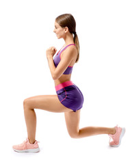 Sporty young woman training against white background