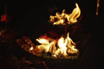 Close up to a burning Krathong or floating lantern during the Loi Krathong Festival or That Luang Festival in Thailand celebrated annually every November