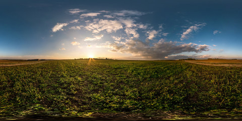 full seamless spherical hdri panorama 360 degrees angle view in field in summer evening sunset with awesome clouds in equirectangular projection, ready for VR AR virtual reality