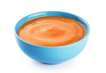 Pumpkin cream soup isolated on white background.