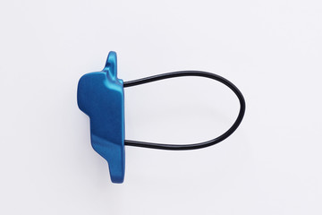 Extreme sports conception. Isolated photo of climbing equipment - blue colored part of carabiner