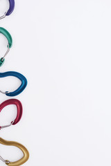 For the climbing. Many of the multi colored carabiners on lying on the white table