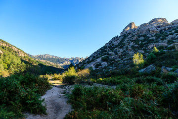 Views of the Pedriza mountain, in Madrid, Spain, in the early hours of the morning when the sun rises between the granite rocks