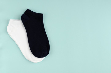 Kids socks composition on blue background. Flat lay.