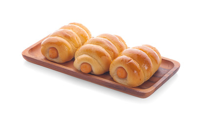 Fresh hot crusty bread rolls. Sausages in dough
