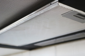 Range hood - detail of a modern kitchen. Convenient operation kitchen hood with toggle modes.