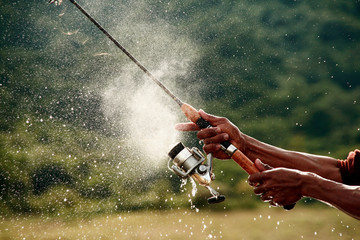 hooking a fish bait in the lake use for fishing.