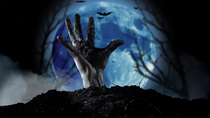 Foto op Plexiglas Spooky graveyard with zombie hand coming out of the ground © kinomaster