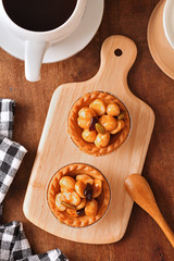    Macadamia nuts tart on wooden table 