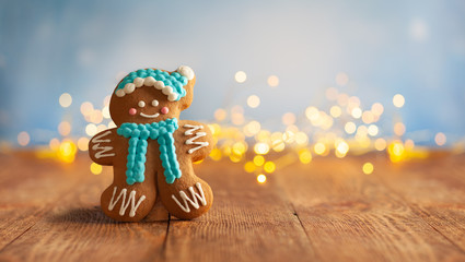 Christmas gingerbread cookies with Christmas decorations on wooden background.