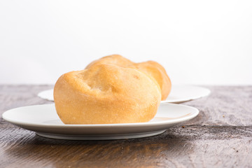 bun baking on a white plate or in a transparent bag on a white background