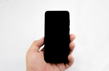 Hand with mobile phone in black for replacement and incorporation of information or image