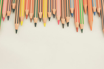 New color pencils on white background © CIGI