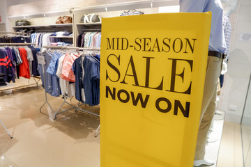 Mid season sales promotion on retail shop entrance