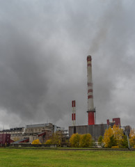 Fototapeta na wymiar Old industrial factory, with smoke in Estonia, Kohtla Jarve City