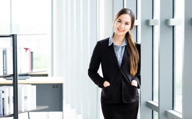 Portrait of a cheerful mature Asian businesswoman at In the office room background,business expressed confidence embolden and successful concept