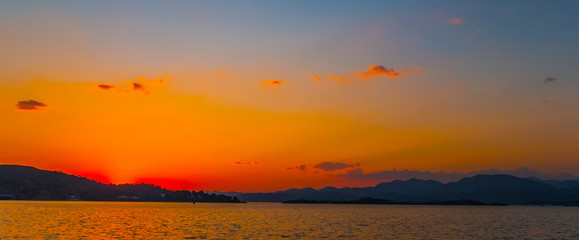 Natural Sunrise Sundown Over Sea Horizon island silhouette