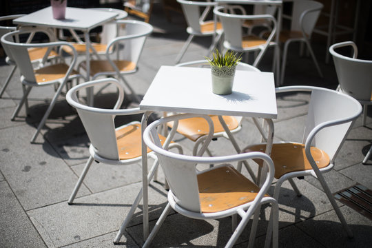 Chairs and tables on a terrace of a restaurant