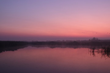 Fototapeta na wymiar Dawn over the lake, sunrise