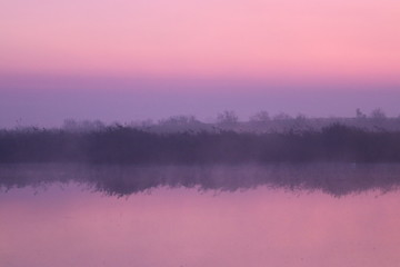 Fototapeta na wymiar Dawn over the lake, sunrise