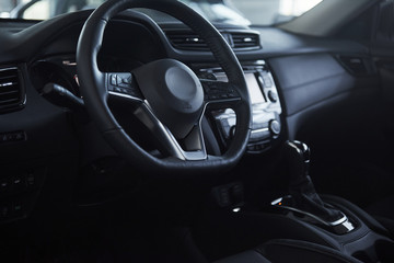 Fototapeta na wymiar Steering wheel. Front part of the new expensive modern car that captured inside