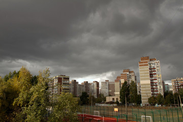 Urban landscape with dark storm sky