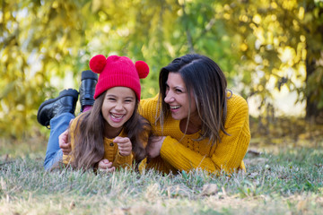 Happy mother and daughter spending time together outdoors