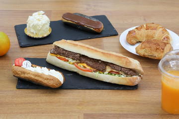 Sandwich and burger on a restaurant table