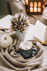 Seasonal home autumn decoration with dried flowers and white pumpkin. Cozy warm image, hygge style