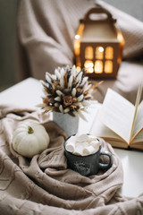 Seasonal home autumn decoration with dried flowers and white pumpkin. Cozy warm image, hygge style