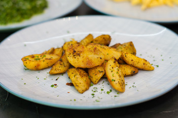 Fried potatoes with spices. Vegetarian food side dish or appetizer.