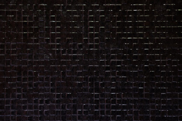 The beautiful background images of the wall tiles in the dark black tiles are tiled.