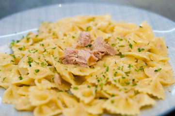 Delicious traditional Italian food. Pasta tuna, cheese and spices