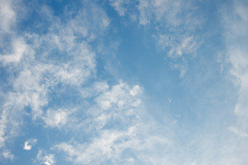 Fototapeta premium Scattered white clouds on blue sky.