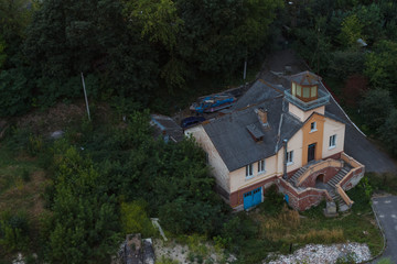 Old and abandoned house in the city. View from the roof of a multistory building. Ukraine