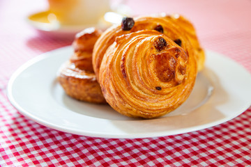 Freshly baked cinnamon buns. Sweet Homemade Pastry baking. Close-up