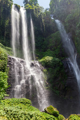Sekumpul Waterfalls surrounded by tropical forest in Bali, Indonesia.