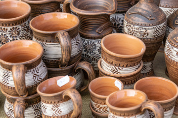 Fototapeta na wymiar The fair of folk craftsmen of pottery. Handmade clay pots