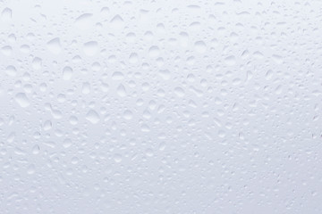Rain drops on window water texture.