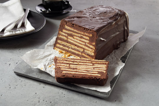 Bar-shaped chocolate cake with biscuits