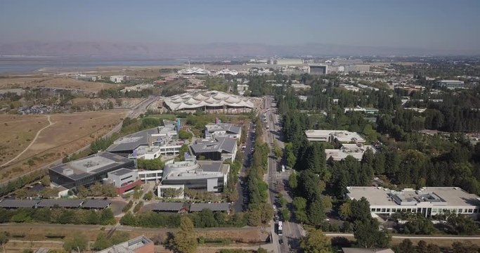 Aerial of new Google plex HQ with solar panels and tensile structure on the roof in mountain view california fly forward