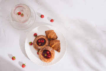Raspberry filled pastries with sugar sprinkles. Selective focus.