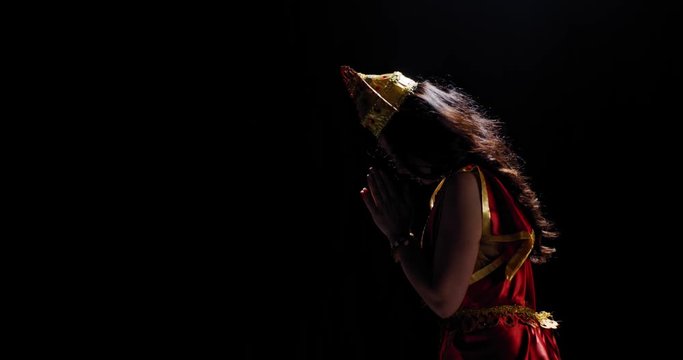 Profile shot of an indian goddess Lakshmi putting her hands together, 4k