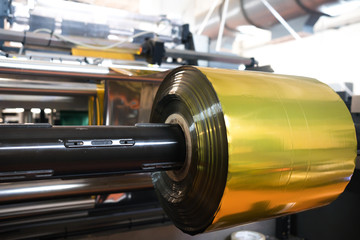 plastic roll inside plastic packaging factory with industrial  machine, plastic packaging is mayor...