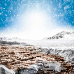 Blurred snowy winter background with shimmering snow.