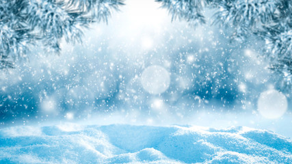 Blurred snowy winter background with shimmering snow.