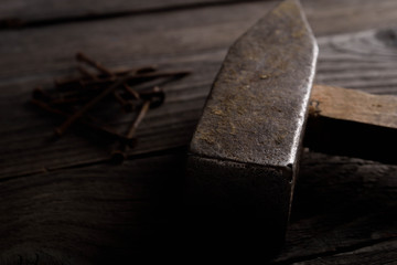 Different workpieces on a wooden background. Hedge wrenches keys, hammer