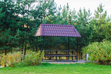  Free gazebo bower for relaxing in the autumn public park.