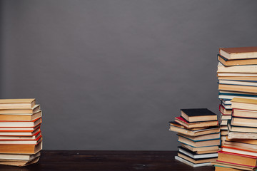 stacks of educational books university library background